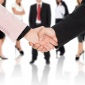 Business handshake with team
