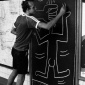 Keith_Haring_drawing_in_the_subway_circa_1981