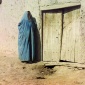 1905_Sergei_Mikhailovich_Prokudin-Gorskii_Sart_woman._Samarkand._Woman_in_purdah,_standing_near_wooden_door_between_1905_and_1915