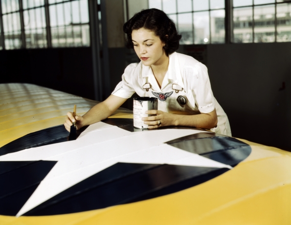 1942_Howard_Hollem_Painting_the_American_insignia_1942_01