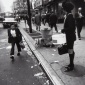 1968_Garry_Winogrand_New_York_City_[woman_with_hat_box,_dwarf_man]_1968