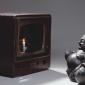 Nam_June_Paik_Buddha_looking_at_old_candle_TV_1992